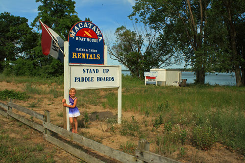 macatawa boat house sup rental sign from the road